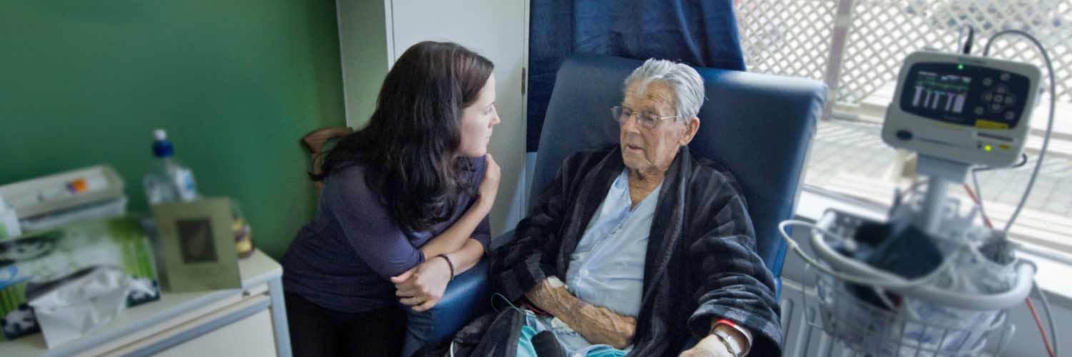 Care assistant visiting elderly patient