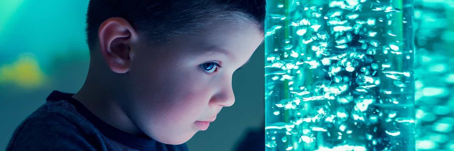 Young boy in a sensory stimulating room