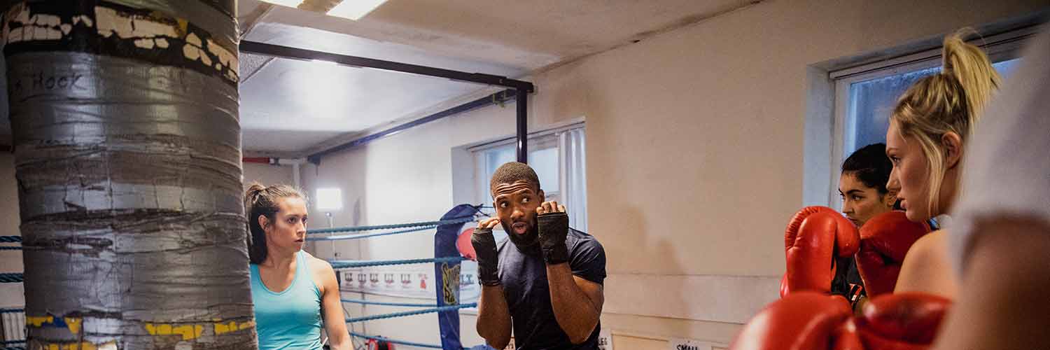 Boxing students taking a lesson