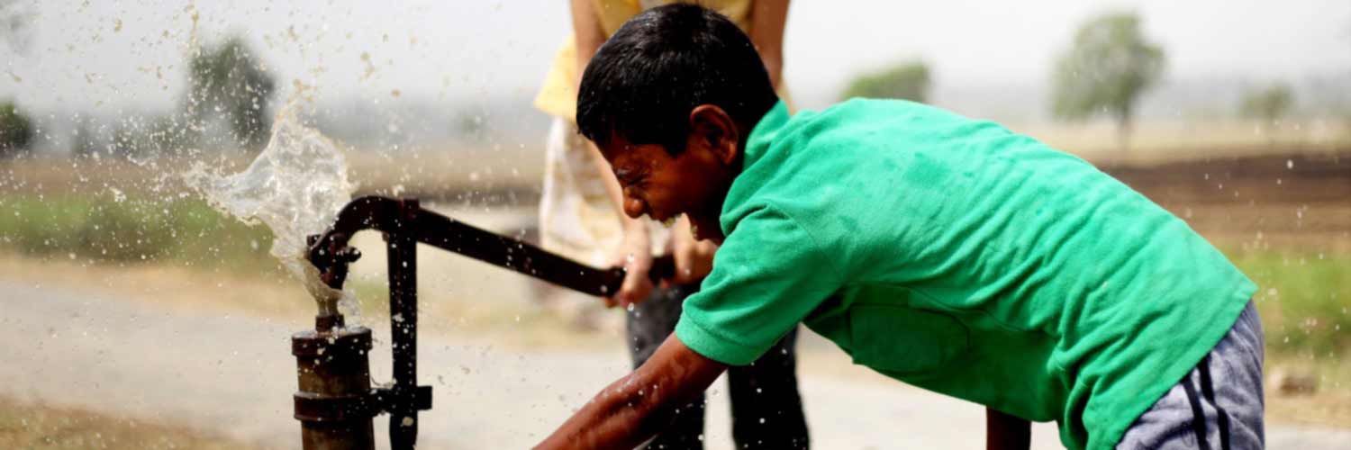 Child using water pump