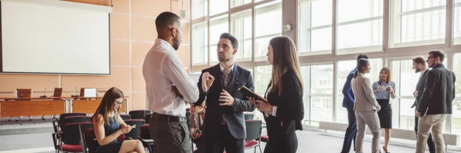 Group of people talking in conference hall