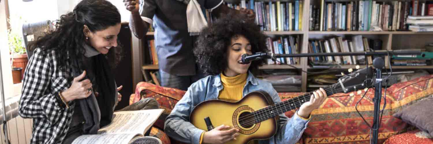 Group of musicians including singer with guitar