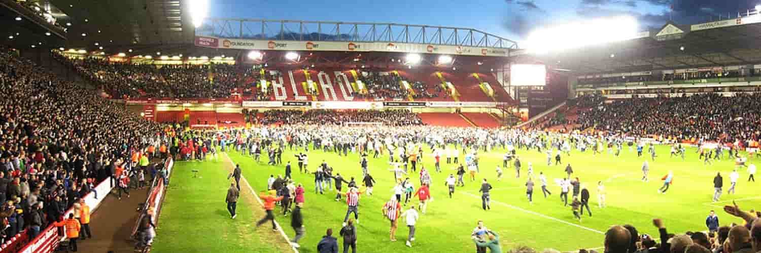 Football fans invade the pitch 