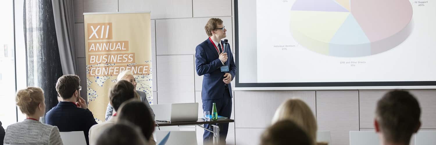 Man presenting his statistical analysis at a business conference