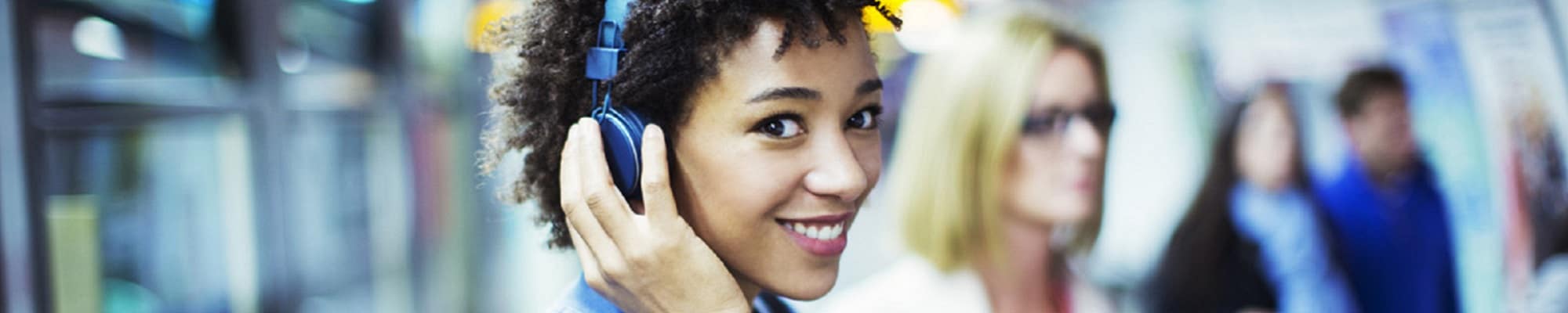 Female listening to music with headphones