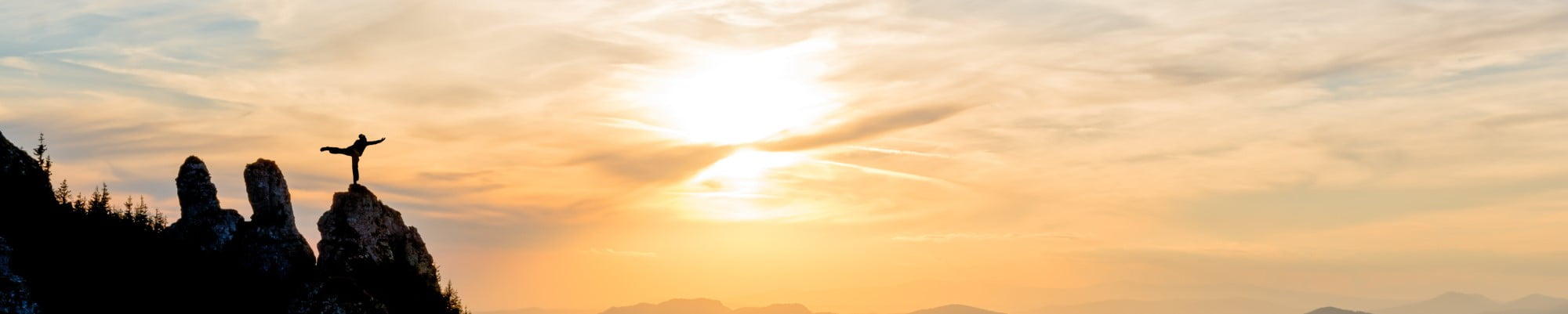 Girl doing yoga at sunrise