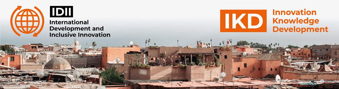 Photo shows a sky line in Morocco of houses with plants set against a bright white sky. Photo by emrecan arık on Unsplash. 