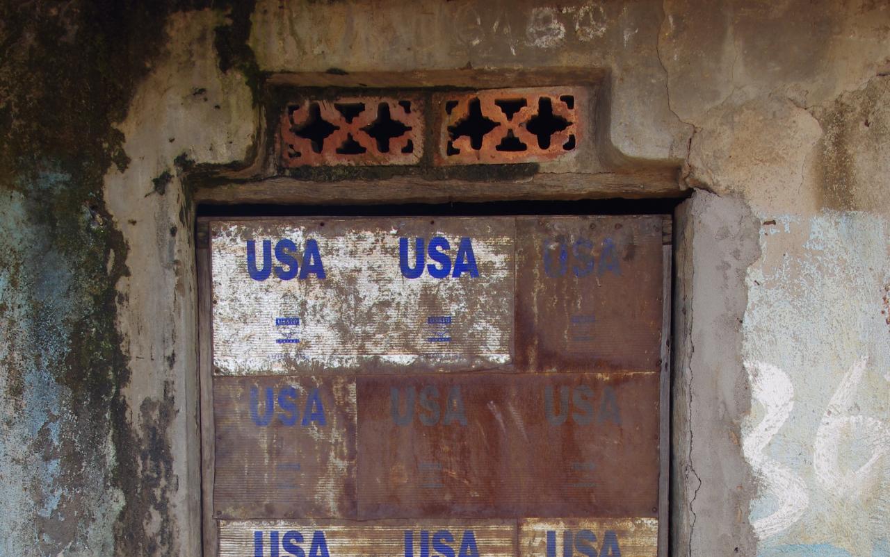 Door made from USAID tin cans, Pabbo, former camp for internally displaced persons, Uganda. Uganda Museum and former camp residents have collected and preserved similar doors as heritage objects (Photo: Giblin 2011)