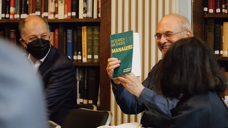 David Wield happily receiving a book from Ivo Kovachev borrowed 30 years previously