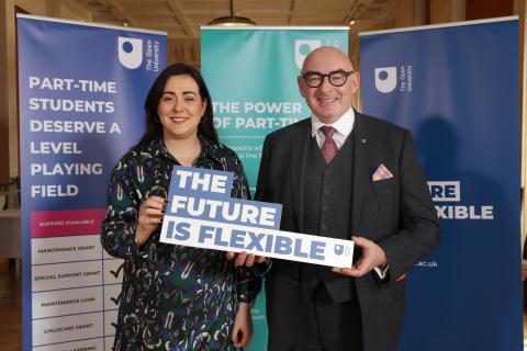 Megan Fearon, Policy Manager, and John D'Arcy, Director of the OU in Ireland, holding a sign reading 'The Future is Flexible'