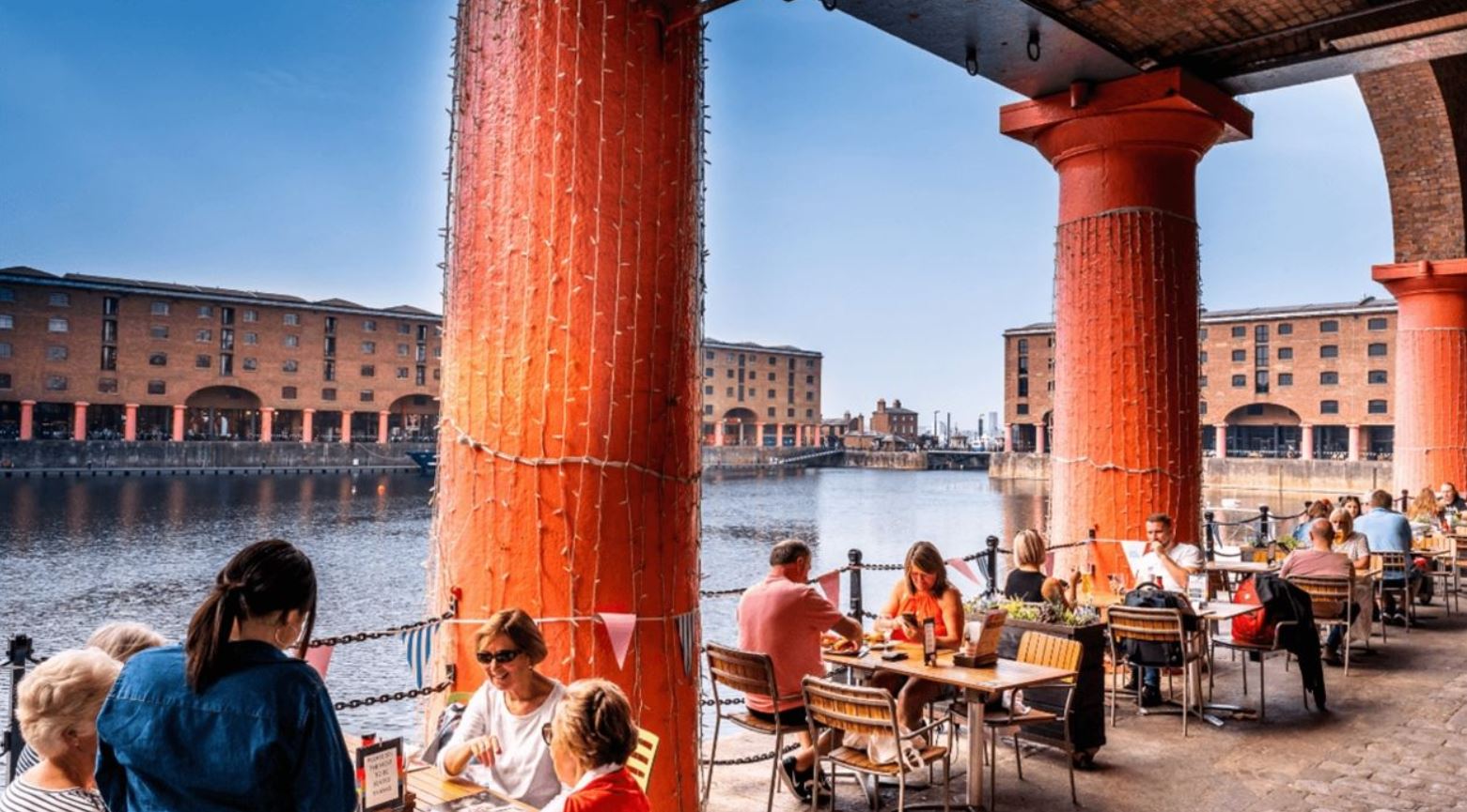 People sitting at tables at the Albert Dock