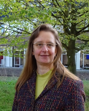 Dr Susanne P Schwenzer in a courtyard at the OU. 