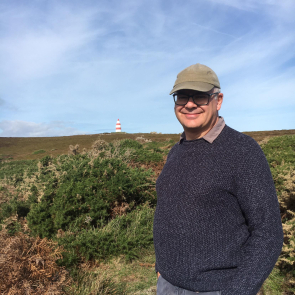 Andrew standing on Chapel Downs, St Martins, Isles of Scilly - with the Daymark in the background