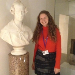 Brigitte Stenhouse next to a bust of Mary Somerville at the Royal Society, London.