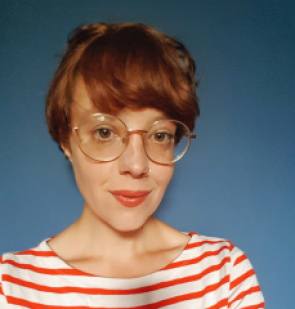 profile picture of marie thompson, wearing round framed glasses and stripey red top against a blue background