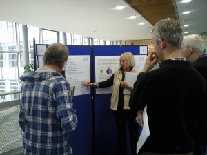 Delegates gathered around a poster at the eSTEeM induction