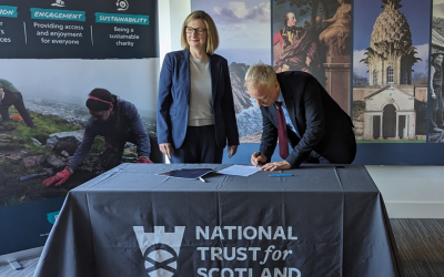 Jane Grant, OU in Scotland Depute Director for External Engagement & Partnerships and Philip Long, Chief Executive for the National Trust for Scotland signing the Memorandum of Understanding