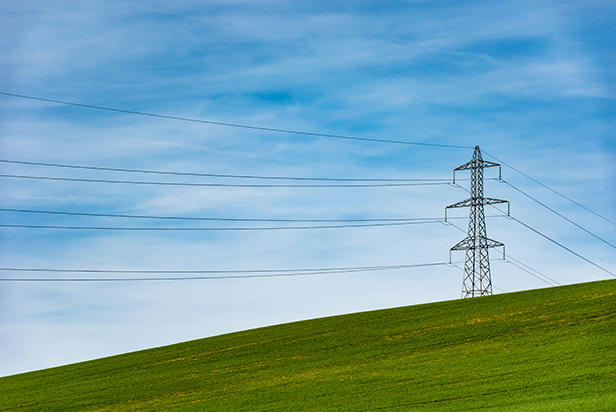 Electrical tower on grass field - 52360 - Photo by Thomas Despeyroux on Unsplash