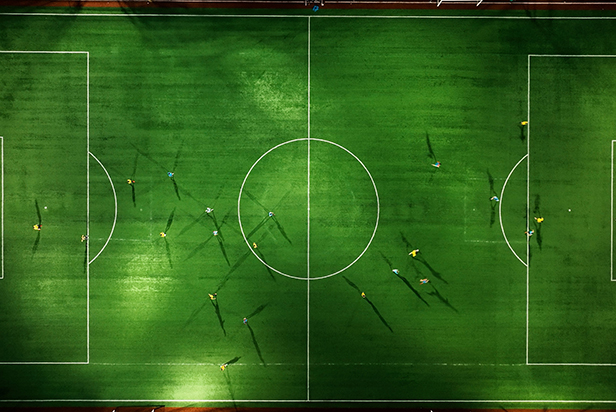 Aerial view futsal team athlete of a soccer field outdoor stadium artificial grass