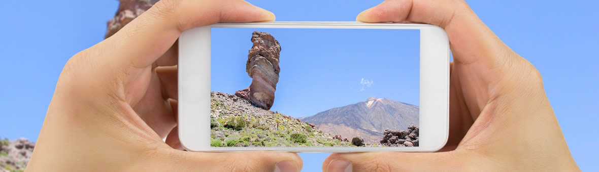 Informal Learning - using a mobile phone to take a photo of a lone tall rock