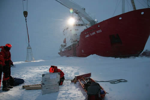Research ship unloads equipment at the antarctic