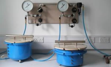 Small blue tubs attached to pressure gauges