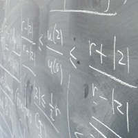 Equations written on a blackboard
