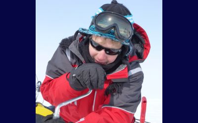 Ivan Sudakow in winter mountaineering wear including goggles, hat, gloves and coat